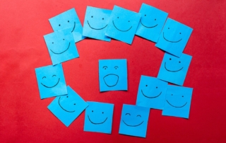 Blue sticky notes with faces